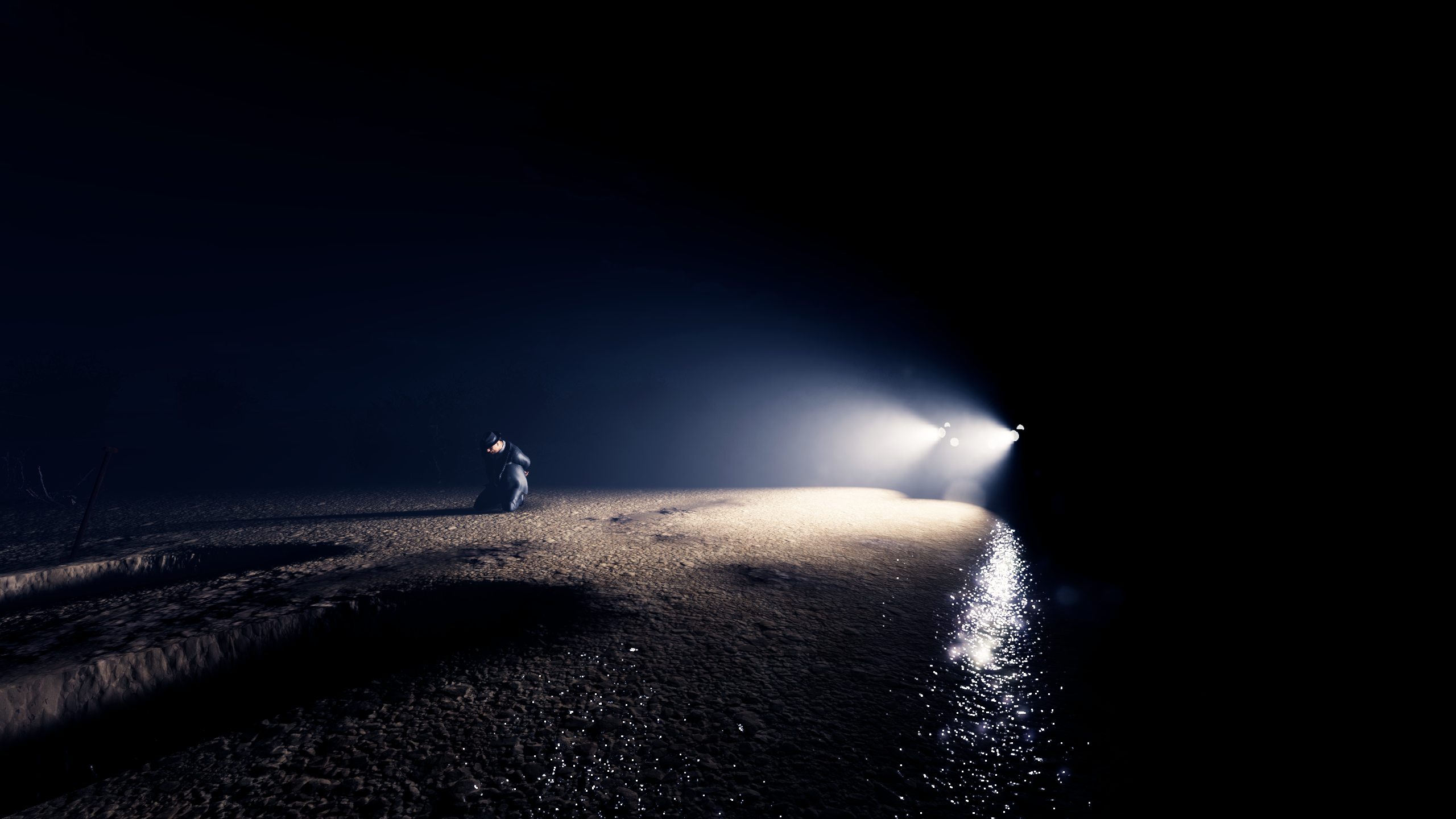 A lone figure caught in headlights on a dark wet road